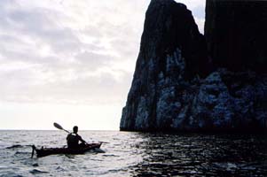 Silhouette of man and rock