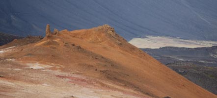 A spire with volcanic ashes for a backdrop