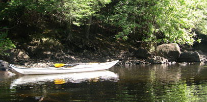 reflections of kayak in water