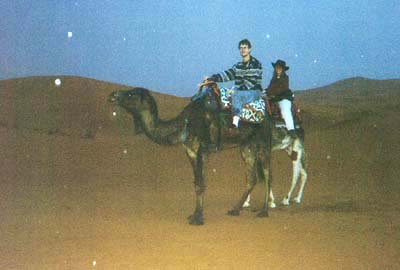 Us on camels in the rain