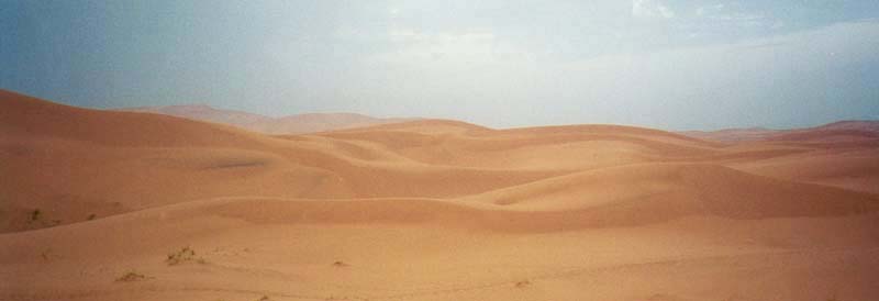 Dunes and rainy skies