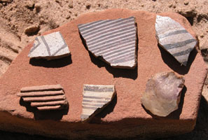 Painted sherds, textured sherd, and tool