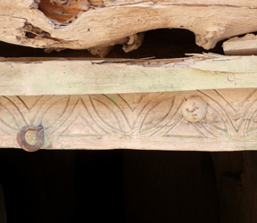 Carved wood head of a doorframe