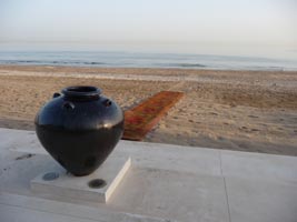 A pot and the beach mat leading down to the hotel beach