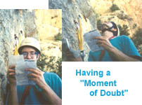 Bill looks at the guide book, and then at the cliff