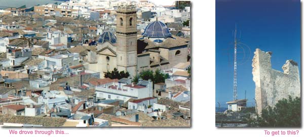 city and ruined tower with TV antenna in the middle