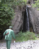 picnic area with water fall and armed guard