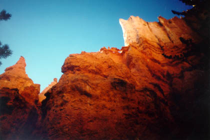 Orange spires encompass the trail