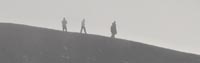 Hikers on the rim of Hverfjall in the fog