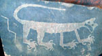 Petroglyph of a cat with open mouth