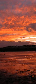 Red sunset over white sands