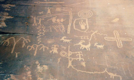 Panel with many petroglyphs typical for this area